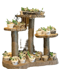 a wooden cake stand with cupcakes on it