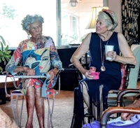 a group of older women sitting in a living room