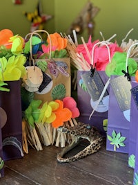a group of bags with colorful decorations on a table