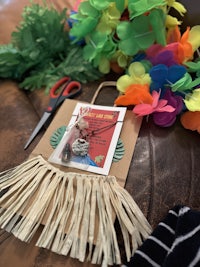 a hawaiian hula bag with scissors and flowers
